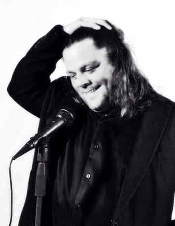 Lenny Vanhorn performing at a microphone