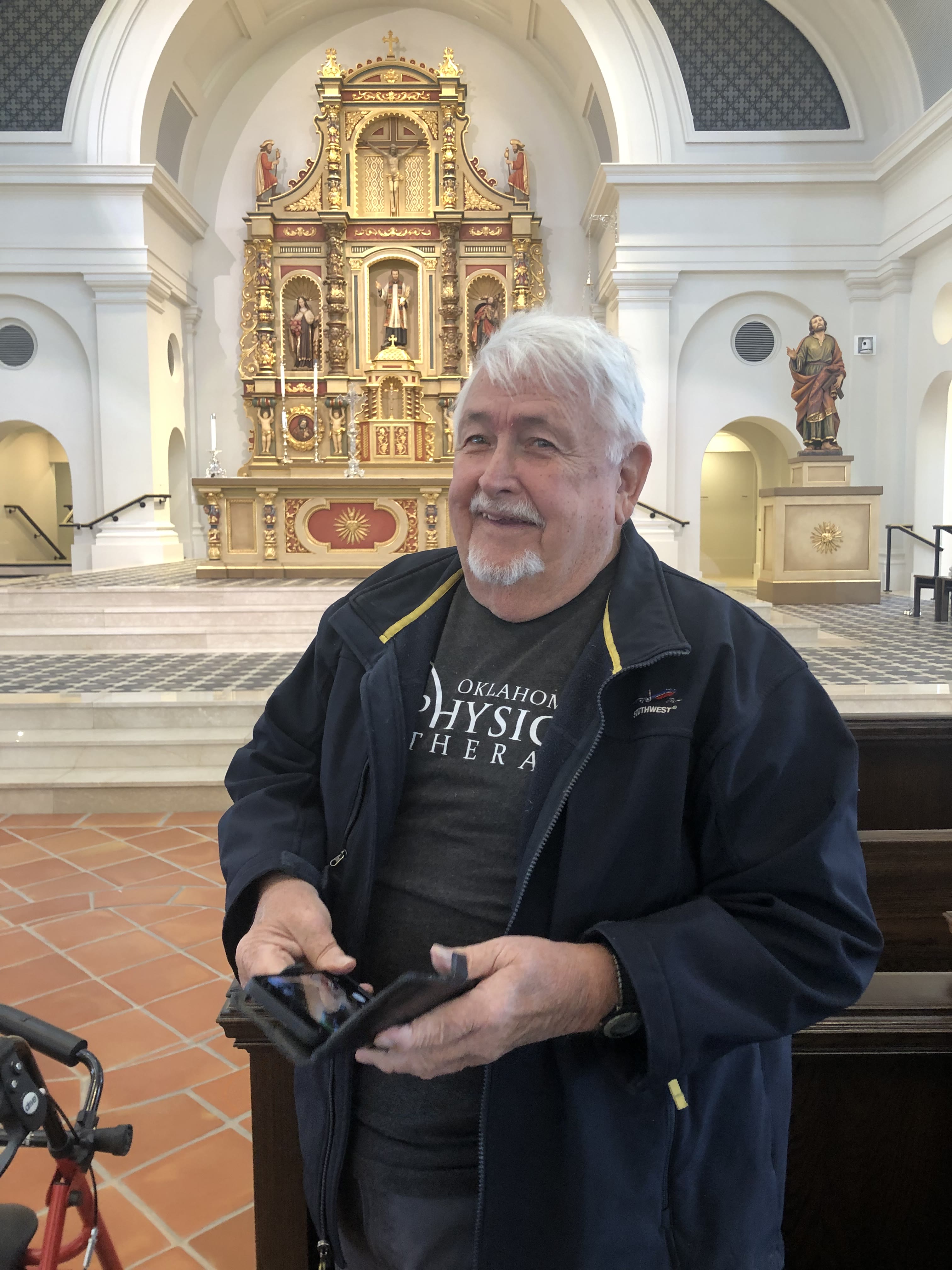 Pop smiling in a church